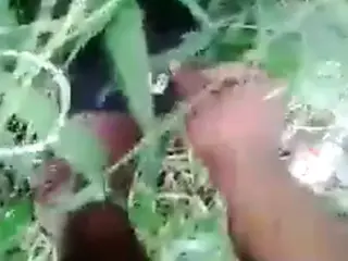Man fucking this lady in the bush