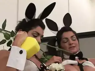 Steamy lesbian threesome taking place in a garage
