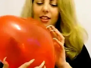 Margo popping baloons with long sharp nails