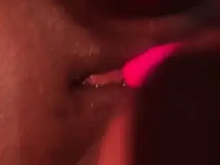 Fat black pussy and a pink vibrator