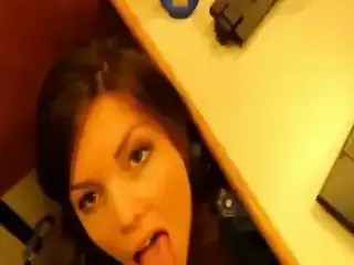 Lustful wife gives head under desk and gets a facial