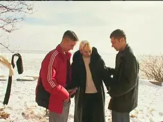 Irina with two guys on the snow