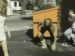 young girl in side street hook by homeless