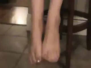 dangling heels off of  stockingb feet
