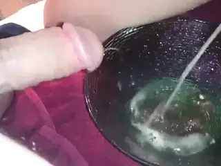 Wifey and me pissing into a bowl