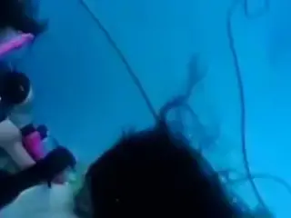 Scuba Girls Try Their Toys In The Pool