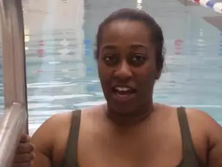 BBW Black woman put a pink latex swimcap