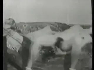 Vintage hairy lady play with bottle.