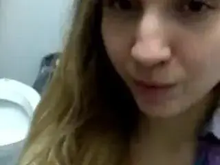 Youtuber Lexi P teasing in a public bathroom