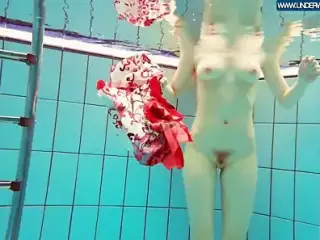 Hot Polish redhead swimming in the pool