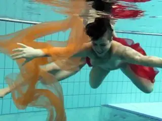 Two underwater girls loving eachother