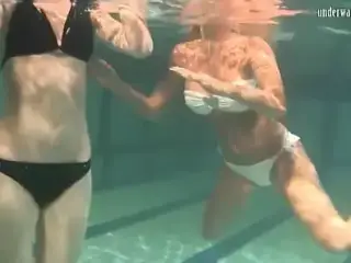 Retro footage of two underwater lesbians