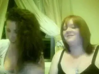 2 gilrs mucking about on webcam flashing tits