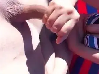 Couple beach handjob