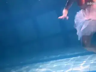 Bulava Lozhkova with a red tie and skirt underwater