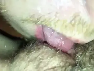Licking her into orgasm while he remains in chastity