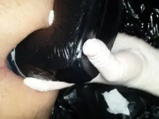 Mistress J practices with the small black strapon agina