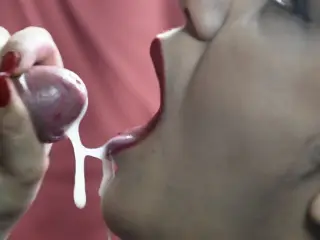 Cumshot on the tongue in close-up