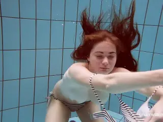 Watch the sexiest girls swim naked in the pool