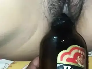 Bengali girl take a beer bottle in her pussy