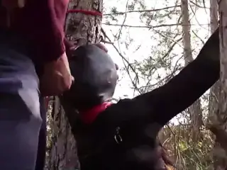 Tied to a tree, masked and outdoor bound deepthroat