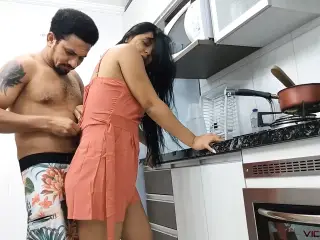 My uncle punching his girlfriend's pussy in the kitchen