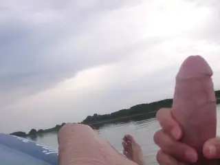 My wife jerks my cock with a happy ending in the inflatable boat on the lake