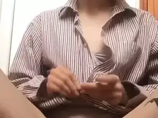 In sexy lingerie fingering her pussy.