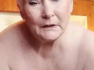 Nasty Granny Showing Off Her Fat Pussy As She Rubs It With A Dildo