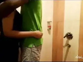 College couple has fun in bathroom