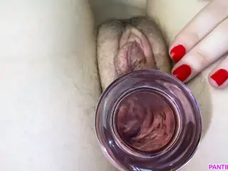 Meaty pussy grips glass dildo close up