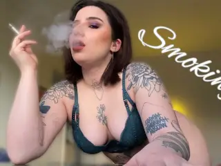 Sexy smoking alternative tattooed model in lingerie