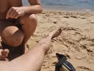 Stepsister gives nude blowjob to stepfather on a beach