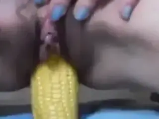 Girl Putting A Corn In To The Pussy