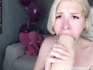 Slim girl has fun with a big dildo