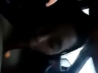 Asian gives blowjob in a car