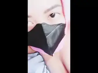 hijab woman playing with dildo in room