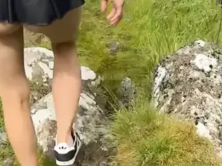 A saucy teen walking through mother nature.