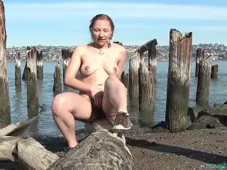 Very hairy Maggie playing on a pier