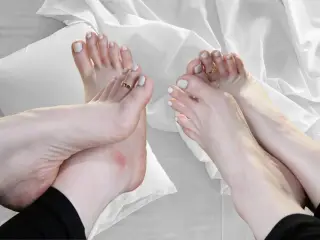 pretty feet with long toes and white nail polish