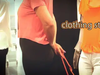 Employee gives blowjob in the store fitting room.