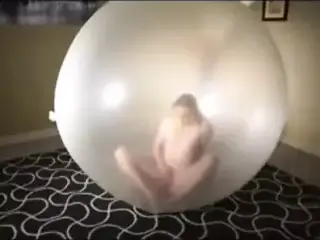 Pop and masturbing inside giant balloon