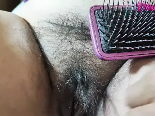 Bbw mom with hairy pussy is combed with a brush