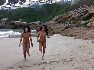 Two amazing German girls sharing a hard rod on the beach