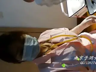 Beautiful Female Surgeon With Surgical Gloves Fisting