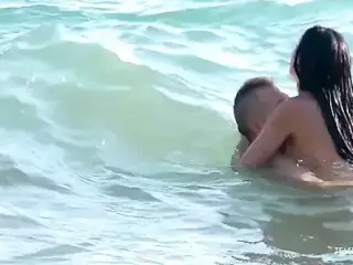 Getting her tits out on a nudist beach always turns on her big cock boyfriend