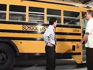 Blond student in pigtails gets fucked by two dudes in the school bus garage