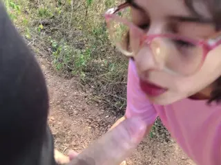 Latina teen gives a blowjob in the woods