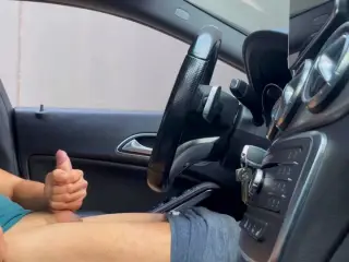 A girl caught a boy jerking off in public in the car and helps him finish cumming