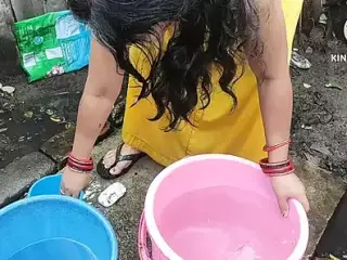 Indian bhabhi bathing outside with
